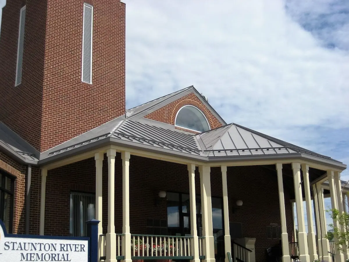 Skilled roofing craftsmen working on a residential roof in Beckley